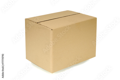 Plain brown closed cardboard delivery box isolated white background photo