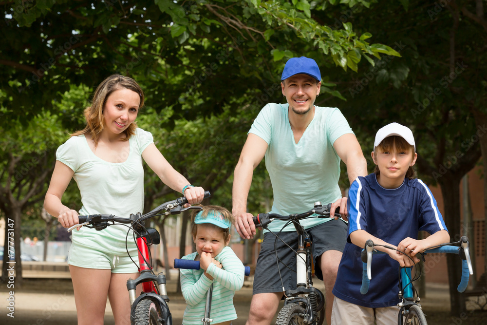 Parents and kids with bicycles