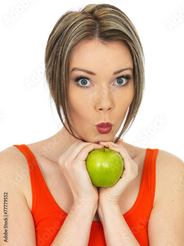 Young Woman Holding a Fresh Ripe Green Apple