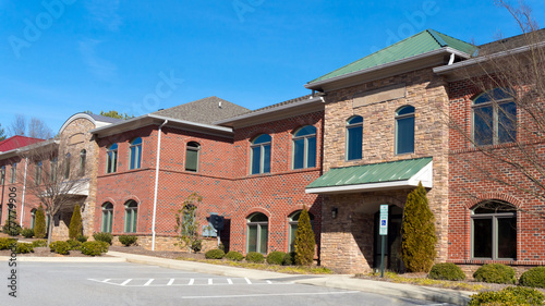 Red brick commercial buildings row with office space