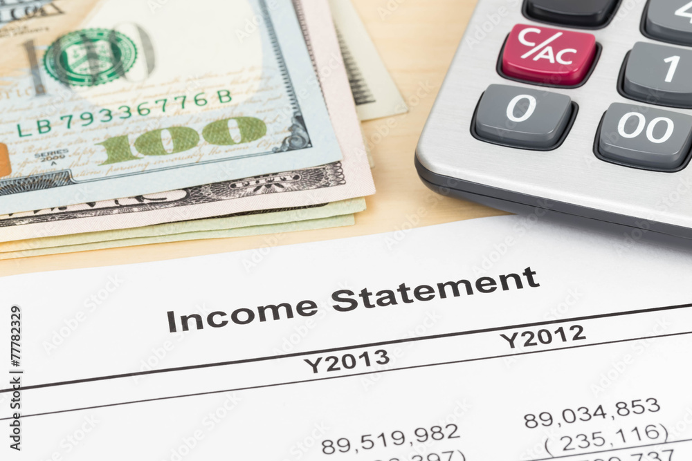 Income statement financial report with banknote and calculator Income statement financial report with banknote and calculator