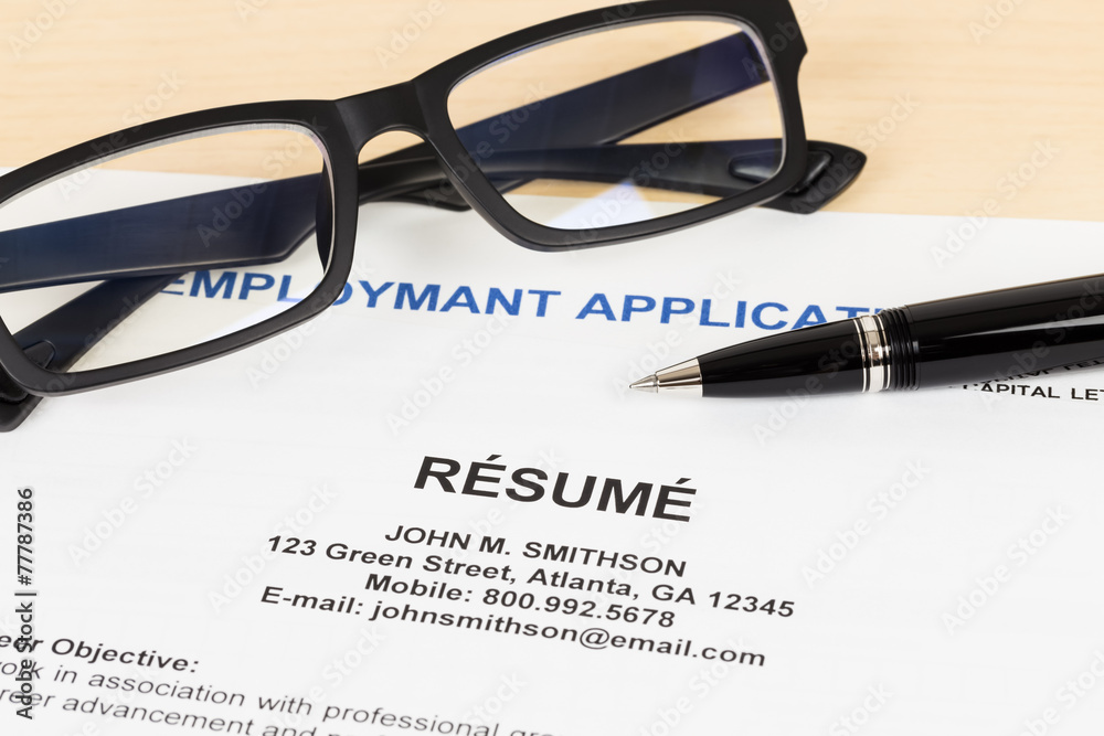 Resume with pen and glasses concept job applying Resume with pen and glasses concept job applying