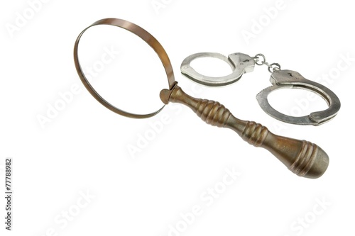 Retro Magnifying Glass and Handcuffs