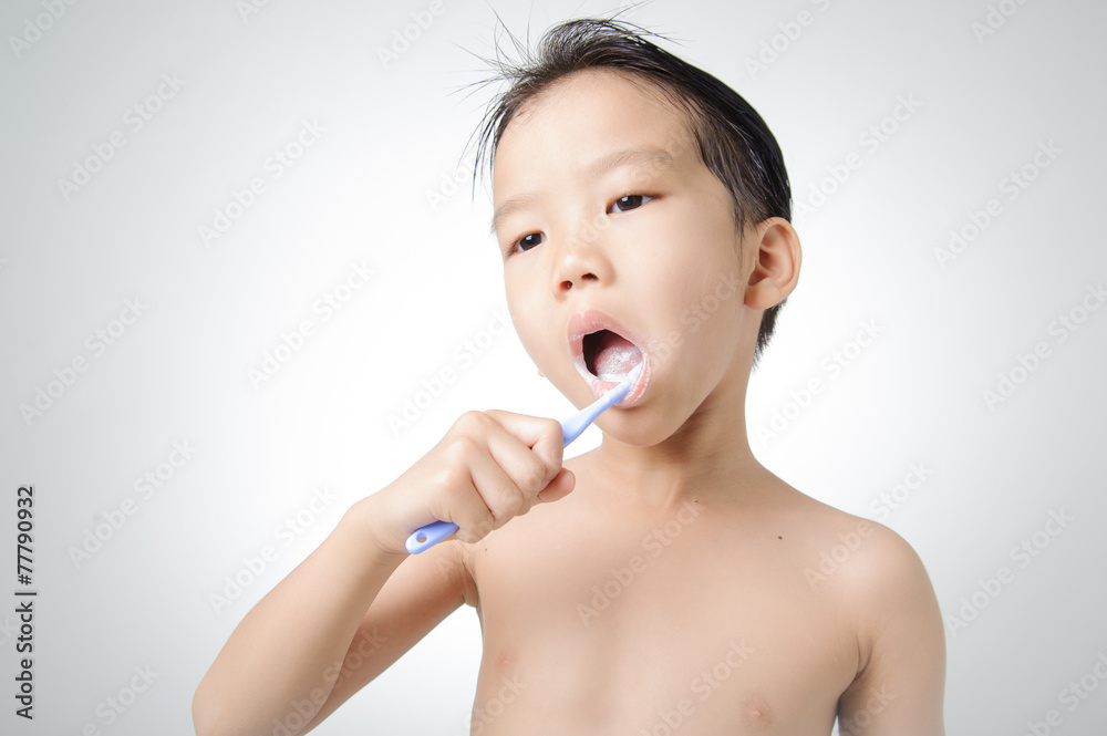 Boy brush his tooth