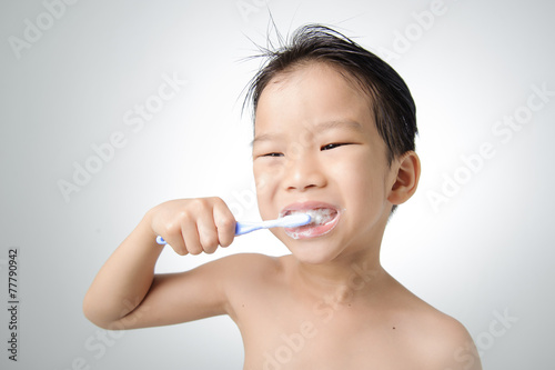 Boy brush his tooth