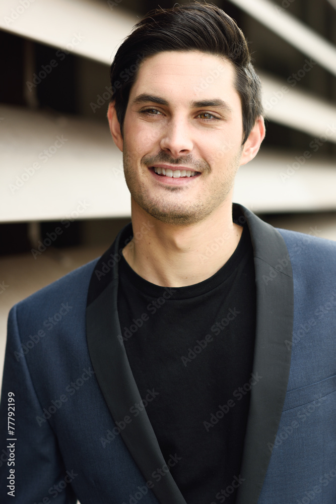 Attractive young businessman in urban background Attractive young businessman in urban background