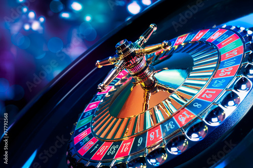 Roulette wheel with a bright and colorful background photo