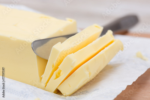 fresh butter in bar form and a knife