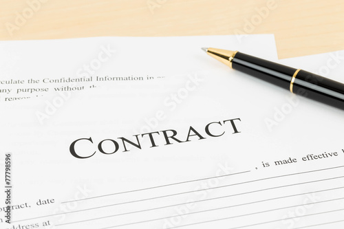 Business contract document with pen