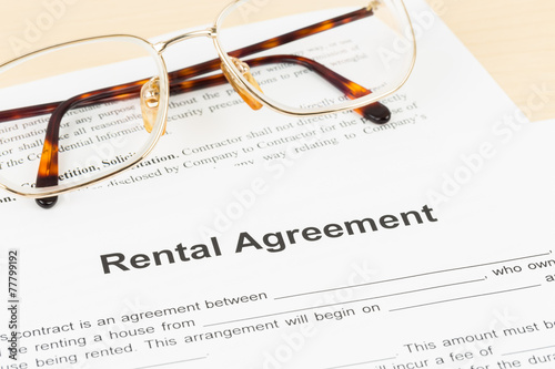 Rental agreement document with glasses