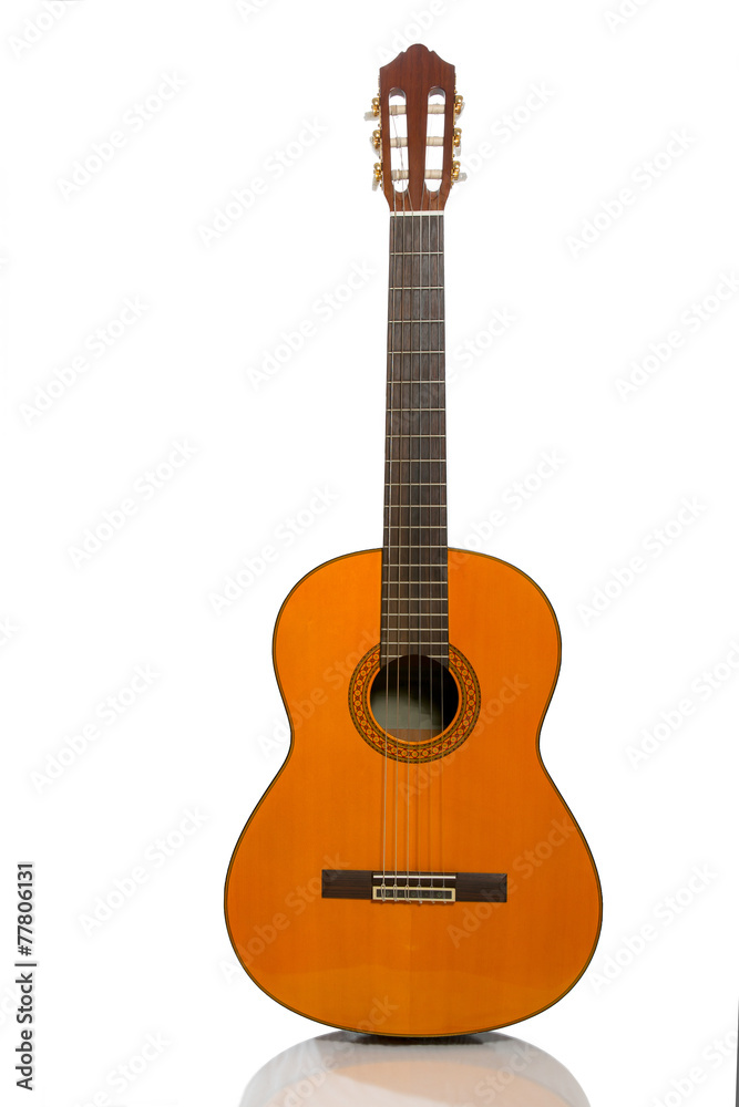 Yellow acoustic guitar on a white background
