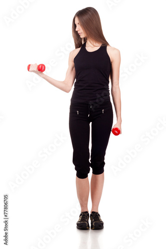 Woman doing exercises with dumbbells red