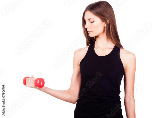 A woman holding a red dumbbell