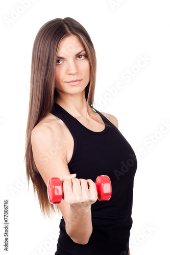 A woman holding a red dumbbell