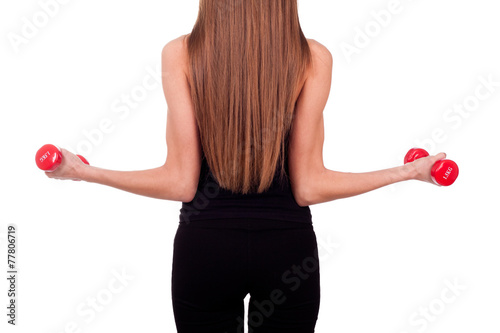 Woman doing exercises with dumbbells red
