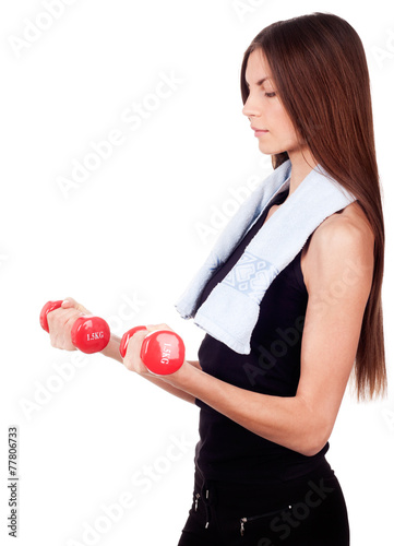 Woman doing exercises with dumbbells red