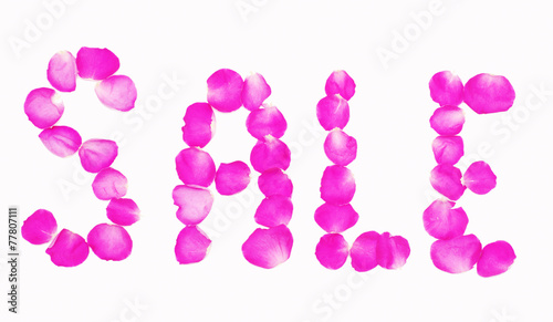 Word " Sale " lined with petals of pink roses