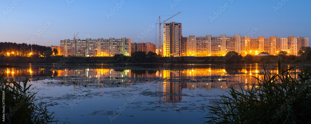 Construction of residential houses on the banks of the river in