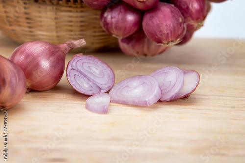 close up sliced onion on wooden chopping block
