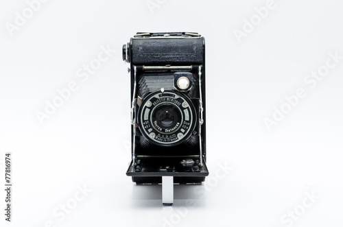 Old vintage camera on white background