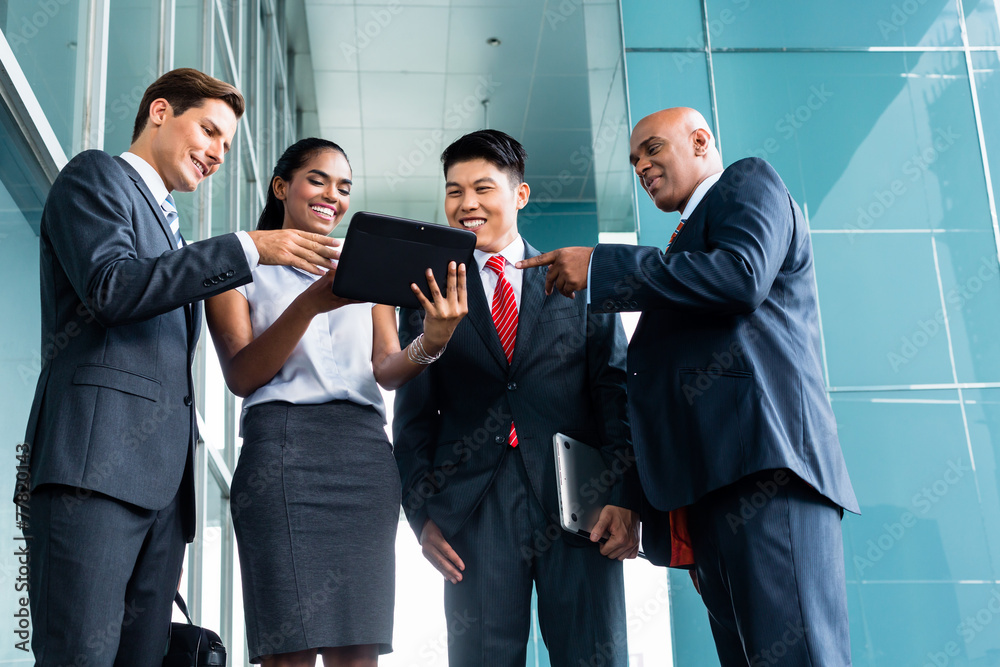 Asian business team presentation on tablet Asian business team presentation on tablet