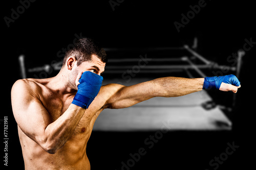 Boxer on dark background photo