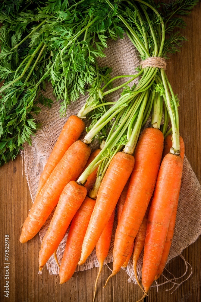 fresh organic carrots bunch on wooden background fresh organic carrots bunch on wooden background