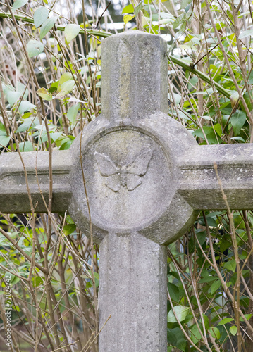 Grabkreuz mit Motte photo