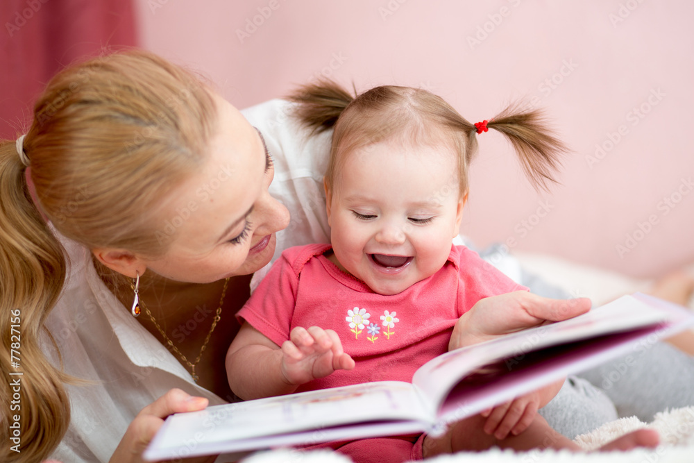 happy mother read a book to child girl happy mother read a book to child girl