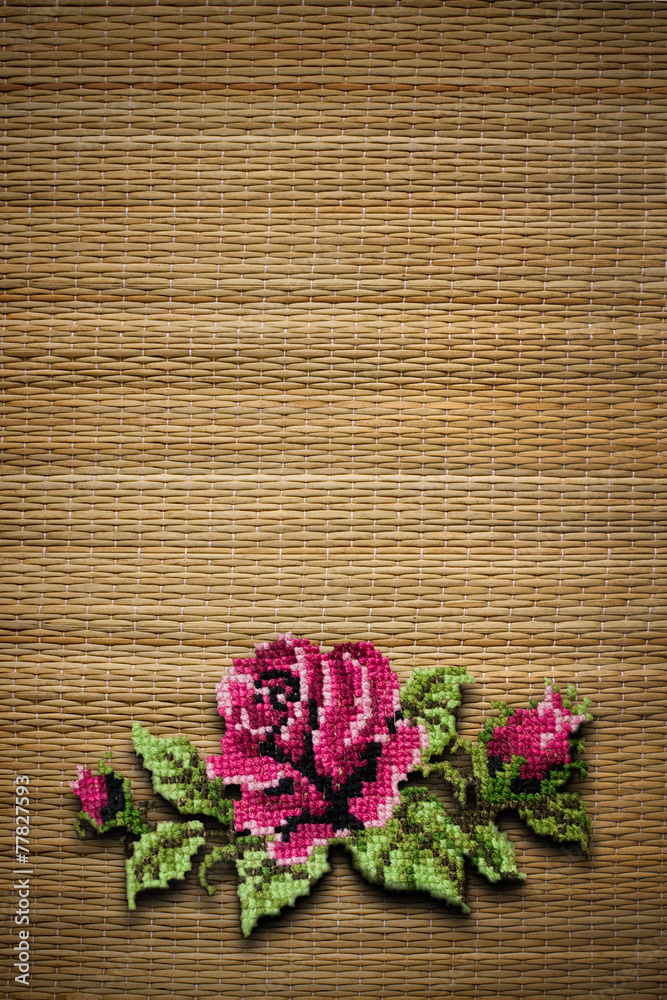 background from straws with the embroidered rose background from straws with the embroidered rose