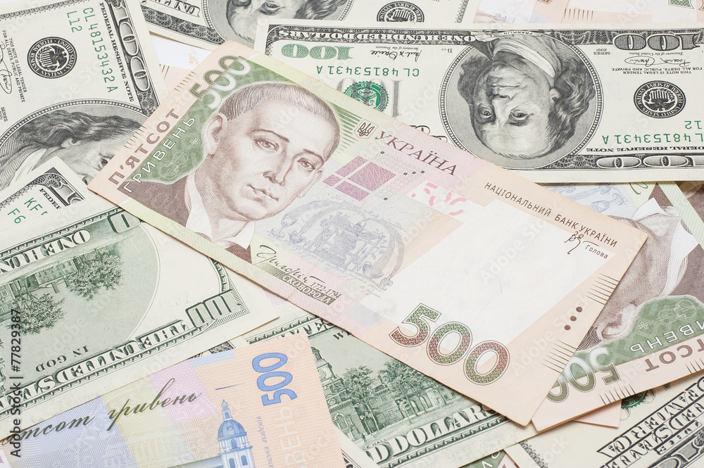 the many dollars and ukrainian money. money background the many dollars and ukrainian money. money background
