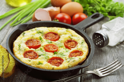 Omelet with vegetables and cheese. Frittata