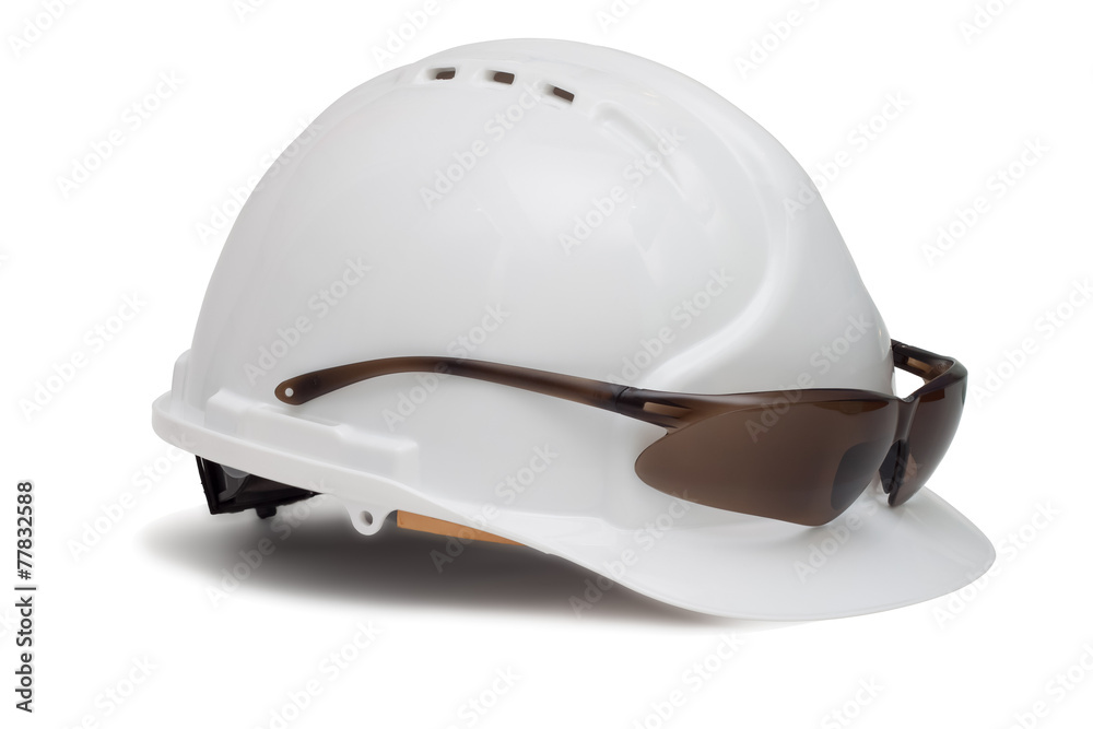 Fototapeta premium Construction helmet and safety glasses on white background