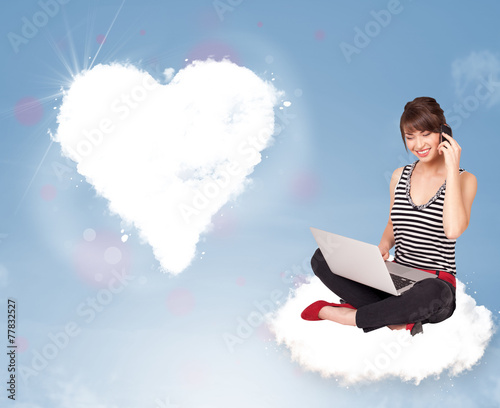 Beautiful lovely woman sitting on cloud with heart © ra2 studio