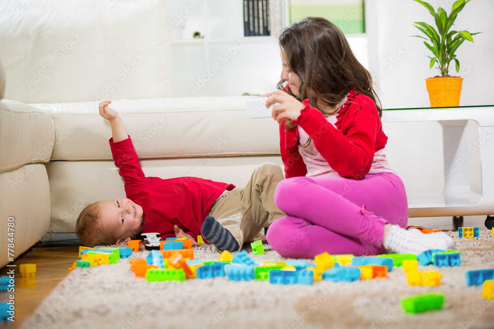 Two children playing with blocks selective focus Two children playing with blocks selective focus