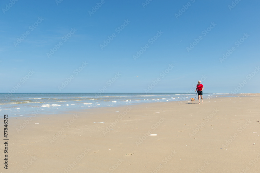 Running with dog at the beach