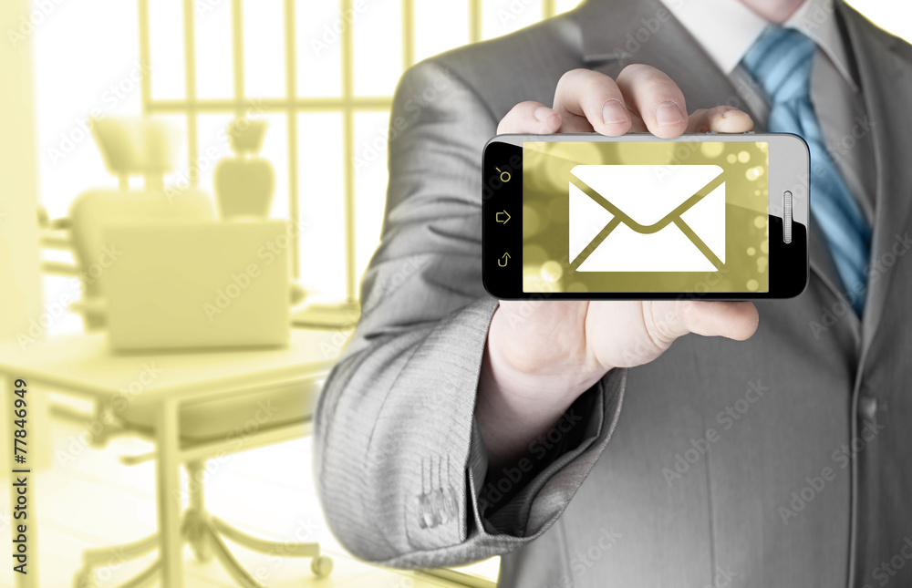 A man holding smartphone with one new message on a screen A man holding smartphone with one new message on a screen