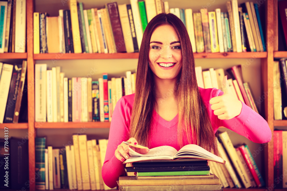 Content girl student in college library Content girl student in college library