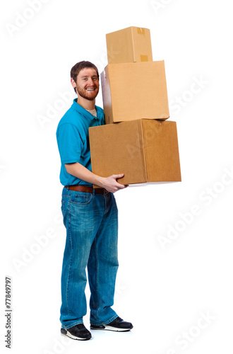 Young male carrying moving boxes