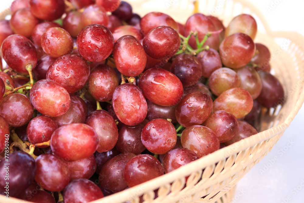 Red grapes on a white background.