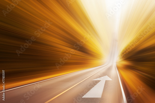Conceptual image of asphalt road and direction arrow photo