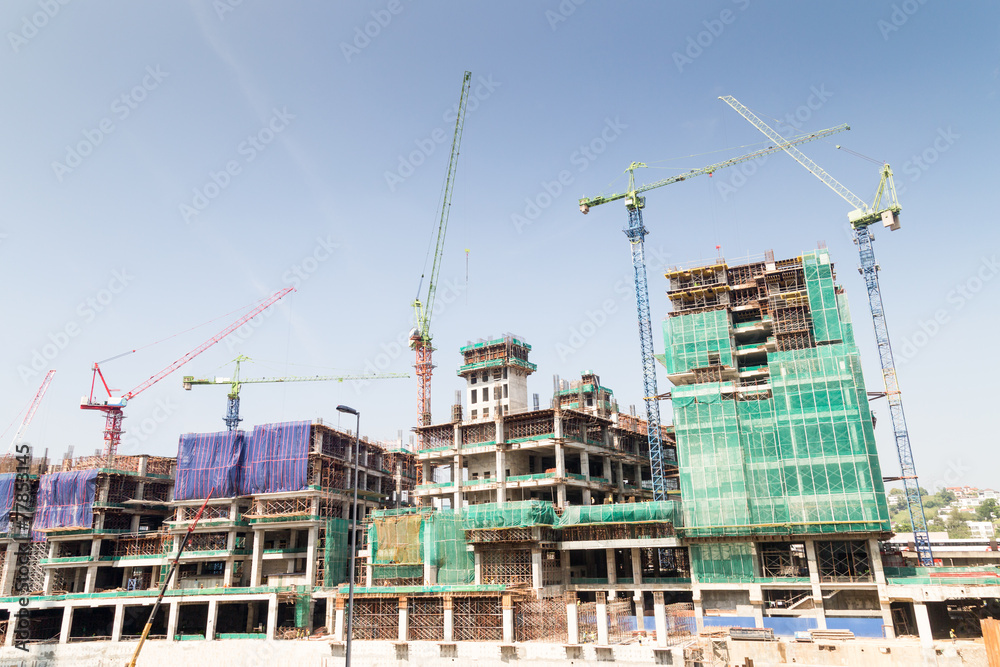 Construction site with multiple cranes