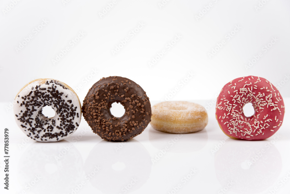 Fototapeta premium Jummy fresh isolated donuts on white background