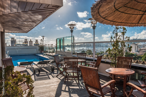 Architectural Swimming Pool at Building Rooftop with Lounge Area