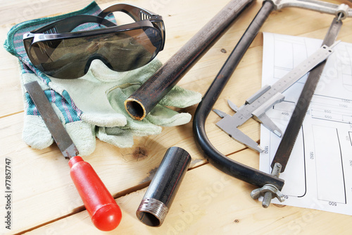 Composition with several locksmith working tools on a workbench