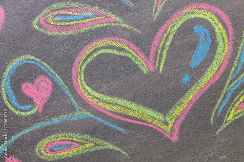 Hand drawn hearts shape on chalkboard background.