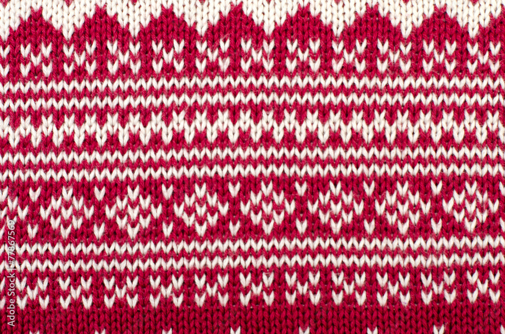 Knit woolen texture. Winter shapes pattern as a background.