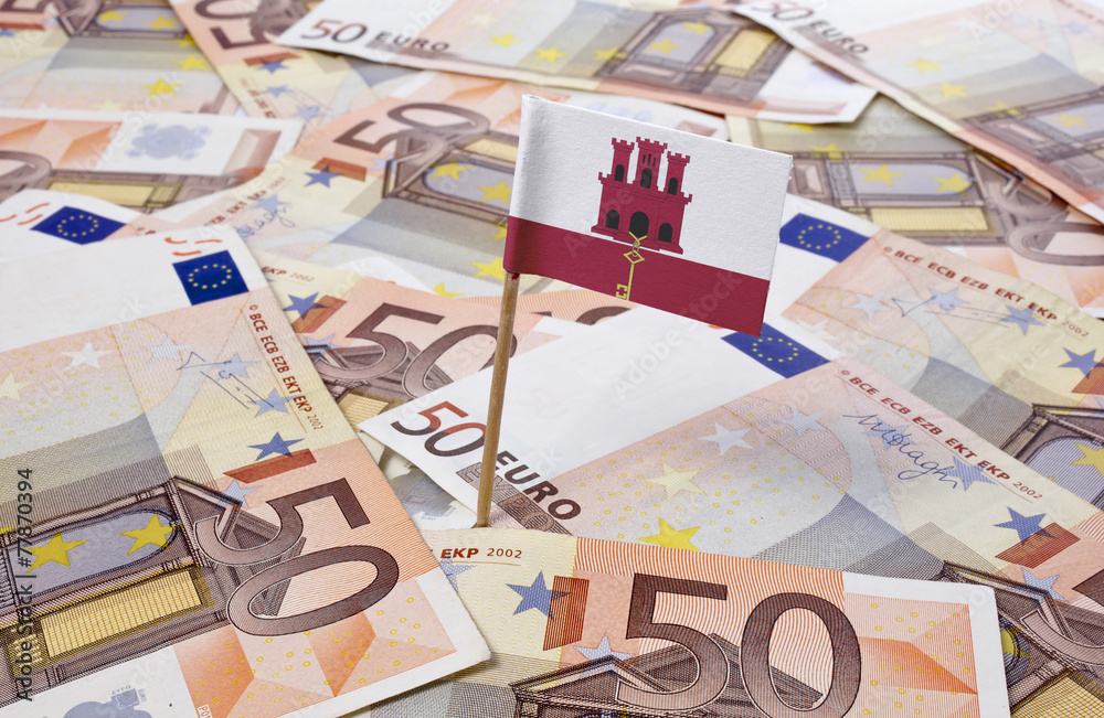 Flag of Gibraltar sticking in 50 Euro banknotes.(series) Flag of Gibraltar sticking in 50 Euro banknotes.(series)