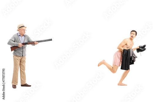 Senior chasing a shirtless man with rifle