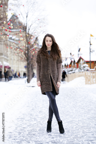 Young beautiful woman in stylish mink coat